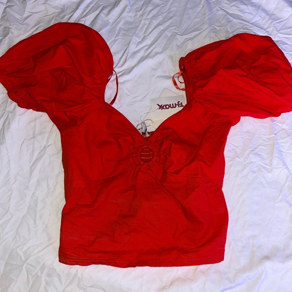 Red top with puffy sleeves